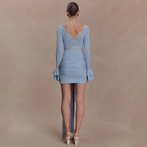 Detail of light blue lace v-back with layered ruffle cuffs and elegant long ribbon