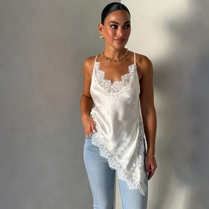 Elegant white satin camisole dress with floral lace trim and asymmetrical hemline
