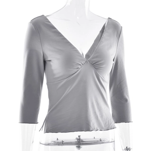 Detail of slim-fit V-neck top in grey-purple with ruched front and pleated texture