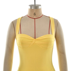 Close-up of yellow bodycon dress showing twisted pleat bust and wide shoulder straps