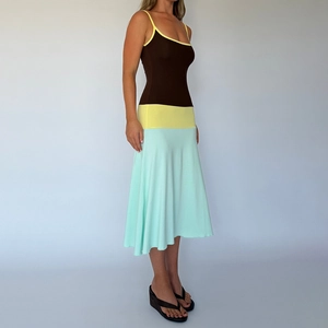 Detail of color-block slim-fit maxi dress featuring brown, yellow, and mint green panels