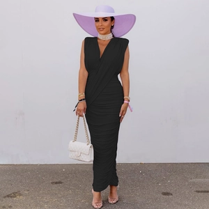 Detailed view of black ruched maxi dress featuring a deep V-neck and elegant draping
