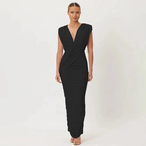 Close-up of ruched texture and V-neck detail on a slim-fit black maxi dress