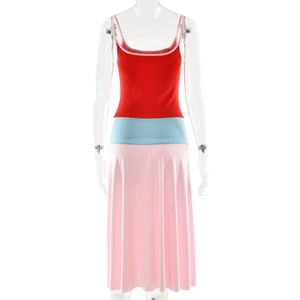 Detail of color-block knit dress featuring a slim-fit red top and pink midi skirt