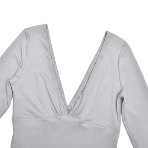 Detail of grey deep V-neckline with pleated ruching and soft elastic fabric texture