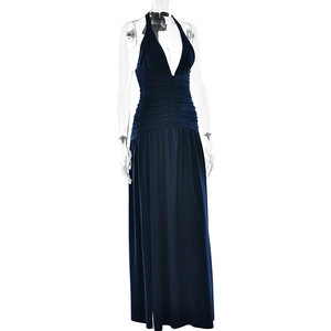 Detail of navy blue halter dress with deep V-neckline and elegant pleated waist texture