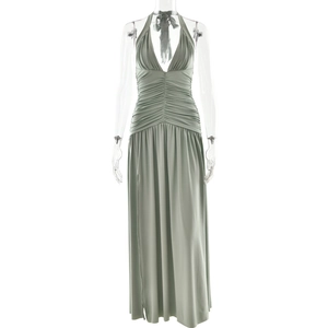 Detail of sage green halter neck dress showing the V-neckline and ruched waist fabric