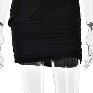 Detailed close-up of the ruched fabric texture on this black slim fit mini dress