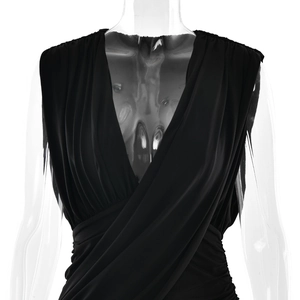 Detail of elegant black deep V-neck sleeveless wrap dress with pleated waist design