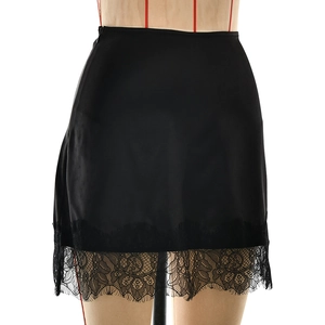 Close-up of black satin mini skirt featuring delicate floral lace trim and side zipper