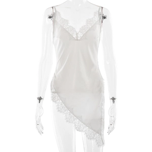 White satin slip dress with lace trim, V-neck, and asymmetrical hem on a mannequin