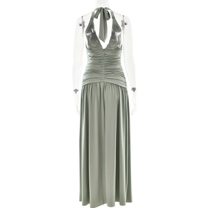 Detailed back view of a sage green halter dress with ruched waist and open back design