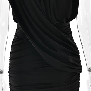 Detail of ruched waist and draped black fabric on a sleeveless bodycon dress