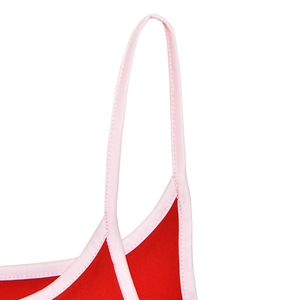 Detailed view of pink thin straps and stitching on a red slimming bodycon dress