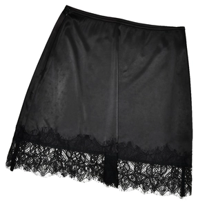 Detailed view of the elegant black satin skirt hem with delicate eyelash lace trim