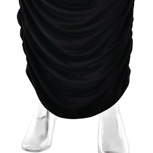 Detail shot of black ruched hemline on a slim fit dress with elastic knit fabric