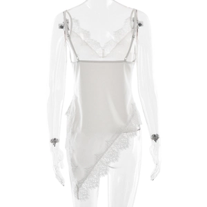 Detailed view of white satin dress with eyelash lace trim and asymmetric hemline