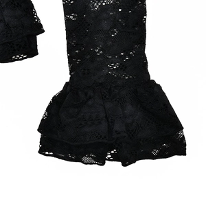 Detail of black floral lace fabric featuring elegant double-layer ruffled sleeve cuffs