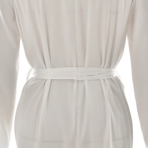 Detail of the back waist tie and silky fabric texture on a white lace-trimmed robe