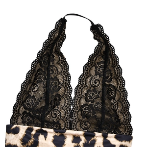 Detail of black crochet lace upper and leopard print fabric on a halter neck dress