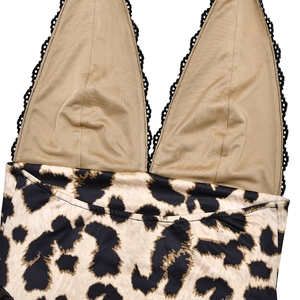 Detail of leopard print bodysuit with champagne gold fabric and black lace trim neckline