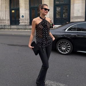 Close-up of vintage polka dot halter neck chiffon top with decorative tie detail