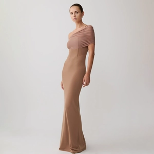 Detail of mocha brown one-shoulder dress showing ruched mesh fabric and corset waist seams