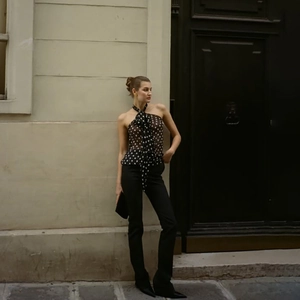 Detail of vintage polka dot halter top with tie neck and elegant chiffon fabric
