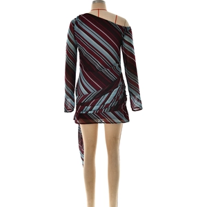 Detail of colorful striped one-shoulder mini dress with pleated waist and draped fabric