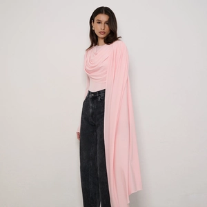 Detail of light pink bodysuit with long draped streamer and gathered pleated fabric