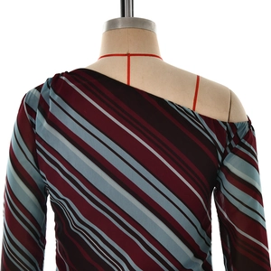 Detail of burgundy and blue striped one-shoulder top with ring buckle tie and soft fabric