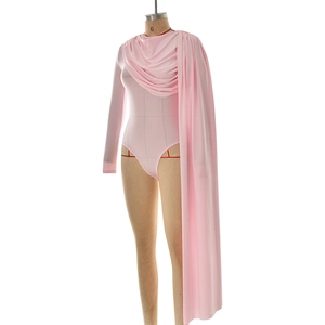 Detail of pink long sleeve bodysuit with asymmetric cape and elegant draped shoulder style