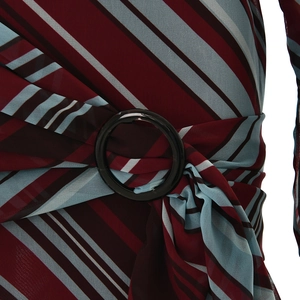Macro detail of wine red striped fabric with a sleek black ring buckle and elegant pleats