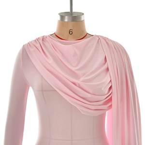 Detail of light pink long sleeve bodysuit with pleated drape neckline and soft fabric