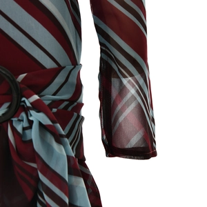 Detail of color-block striped chiffon dress with a metal ring and waist tie feature