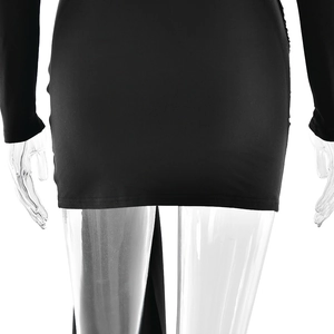 Detailed view of the stitching and hem on a black bodycon dress with high-quality fabric