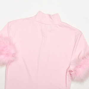 Detail of pink high neck slim top featuring elegant faux feather cuffs on short sleeves