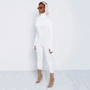 Detail of white ribbed bodysuit with high neck zipper and thumbhole cuffs on sleeve