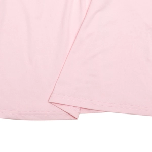 Detailed close-up of double-stitched hem on light pink mock neck slim fit T-shirt