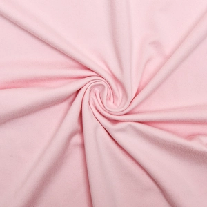 Macro detail of soft pink knitted fabric texture with delicate ribbing and smooth finish