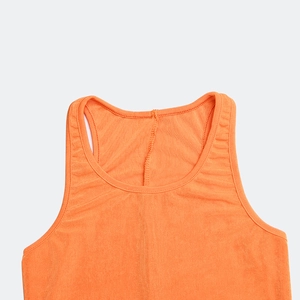 Detail of orange knitted tank top showing ribbed texture and high-quality stitching
