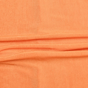 Macro shot of bright orange ribbed knit fabric texture with fine vertical stripes