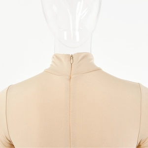 Close-up of beige high-neck bodysuit featuring seamless stitching and back zipper detail