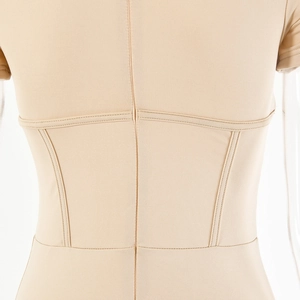 Detail view of the back seams and stitching on a slim-fit beige bodysuit