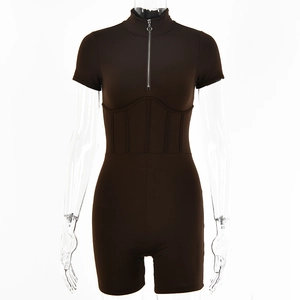 Detail view of the half-zipper collar and waist stitching on the slim brown bodysuit