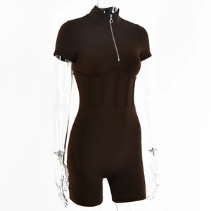 Detail of slim-fit brown romper featuring a stand collar and front metal zipper closure