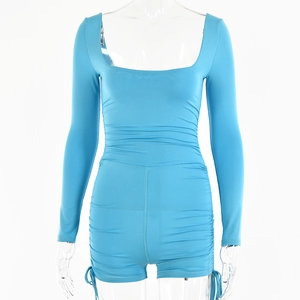 Detail of sky blue square neck romper with side drawstring and ribbed knit fabric