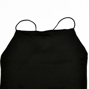 Detailed close-up of a black slim-fit dress featuring spaghetti straps and a square neckline