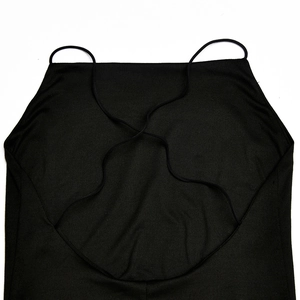 Detailed view of the backless cross-strap design and fine ribbed fabric texture
