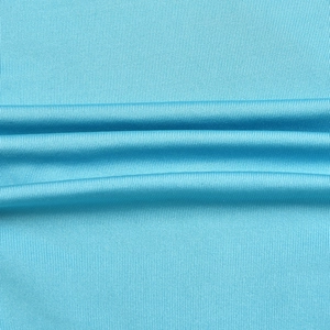 Close-up of light blue vertical ribbed knit fabric texture on sexy backless jumpsuit
